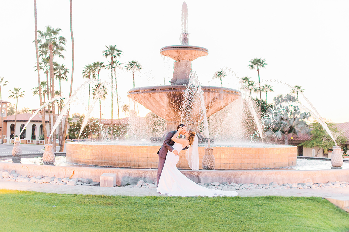 Indoor Outdoor Phoenix Wedding Venue Arizona Grand Resort Spa Bride And Groom In Front Of Fountain At Arizona Grand Resort Weddings