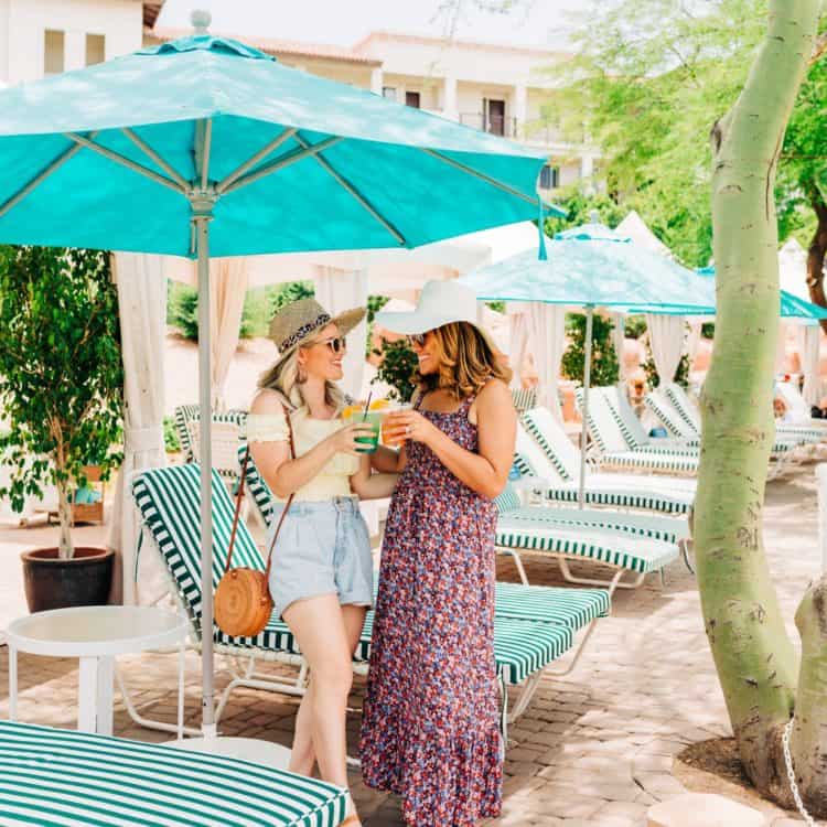 Guest enjoying drinks under parasol