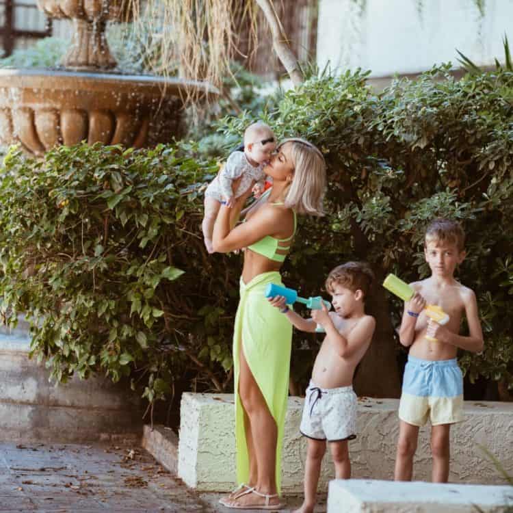 A Family stood by greenery