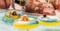 Family floating in rubber rings at Oasis Water Park