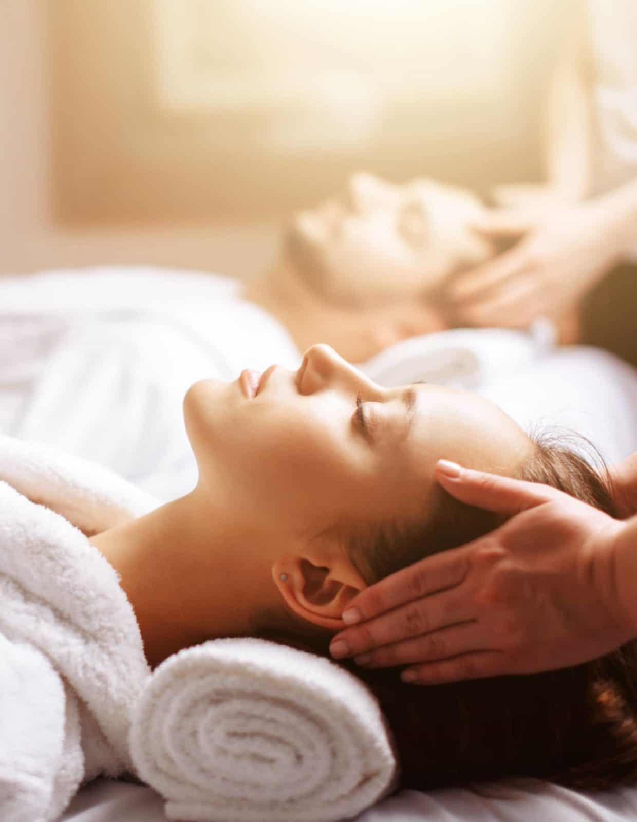 Two people receiving spa treatments