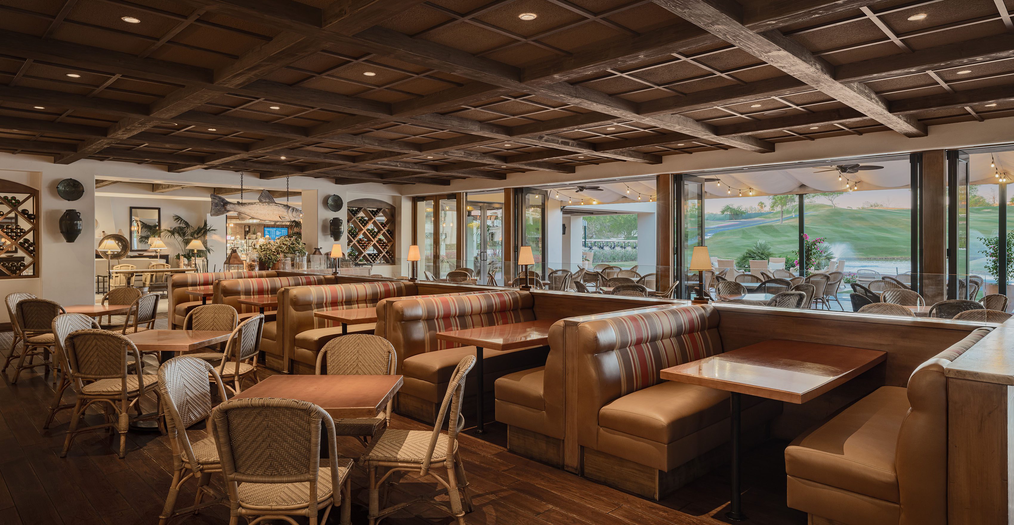a dining room with booths, tables, and chairs