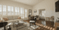 Bright and airy Sedona Grand Suite with elegant furnishings, private bedroom, and sunlit sitting area.